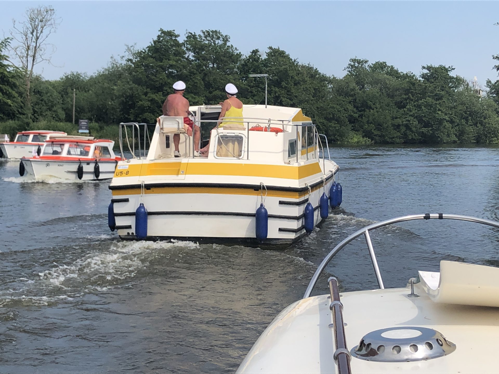 Beware of anyone at the helm of a boat wearing a captain's hat. It's generally worth avoiding them. In this case, they were speeding through the most congested part of Horning.