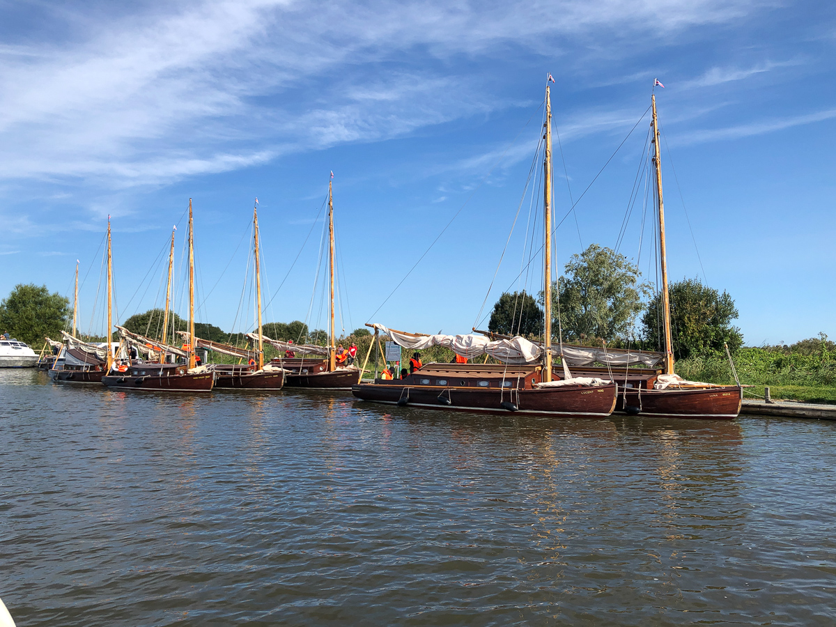 A flotilla of Hunter's Yard sailing boats at St Benets