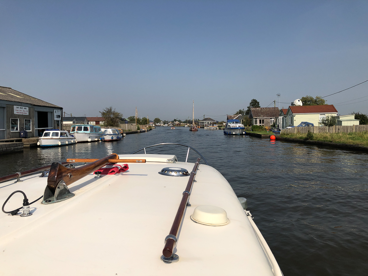 Holiday rentals along the banks of the River Thurne at Potter Heigham west of the bridge