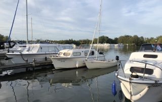 White Lady with our Wanderer dinghy moored alongside on the Horning to Thurne Downriver Race day.